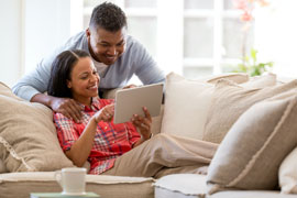 Young business owners on their company tablet